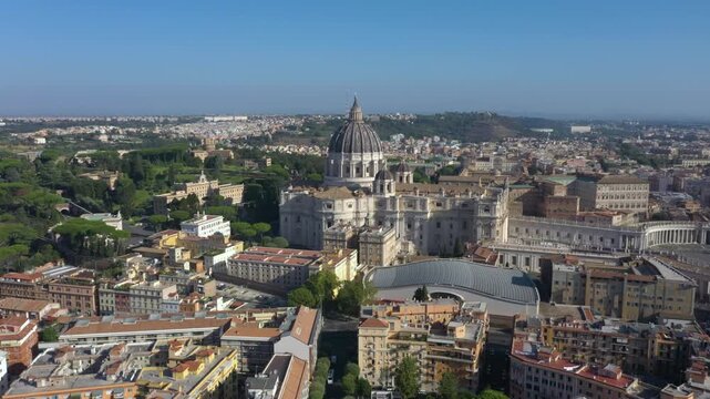 Aerial drone rising above St. Peter&rsquo;s Basilica, and revealing its majestic dome, and the vast Piazza San Pietro, symbolizing the heart of the Catholic Church and Rome&rsquo;s timeless beauty.
