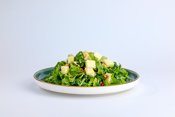 Plate of Fresh Vegetable Salad with Pomegranate Seeds and Cheese Cubes