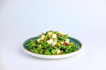 Plate of Fresh Vegetable Salad with Pomegranate Seeds and Cheese Cubes