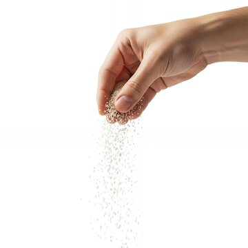 Hand sprinkling MSG granules in motion, isolated background