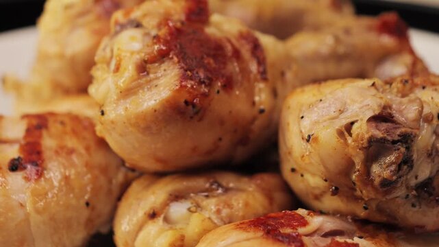 Close up of grill roast bbq chicken leg with addition herbs and spices. High quality 4k footage