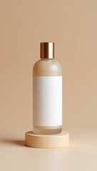 A light beige bottle with a gold cap sits on a beige circular pedestal against a neutral background.