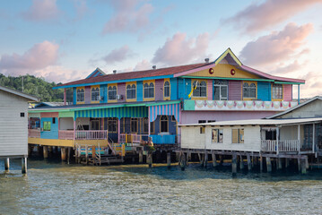 Vibrant stilt houses of Kampong Ayer, the historic water village in Bandar Seri Begawan, Brunei. Traditional architecture over water under a soft sky