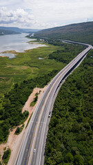 Drone shot The M6 motorway Nakhon Ratchasima Province - Bang Pa-in Lam Ta Khong River and Mountain. Motorway Korat Thailand