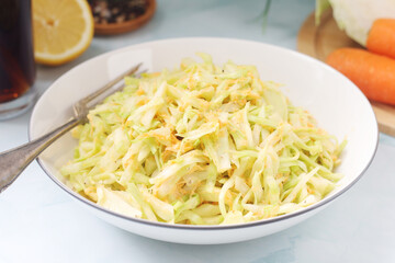 A bowl with coleslow salad