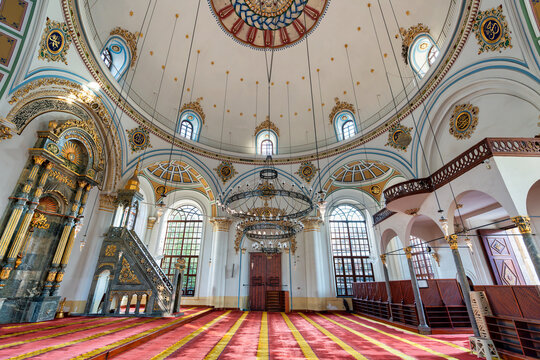 Interior of Aziziye Mosque, Konya, Turkey. Ornate dome, chandeliers, mihrab, and minbar highlight rich Islamic architecture and design