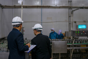 Employees are working at canned fish factory.