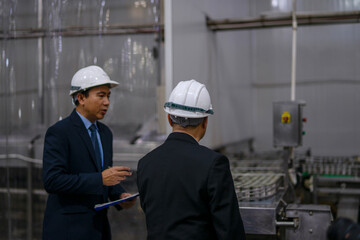 Employees are working at canned fish factory.