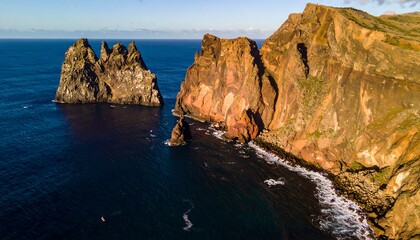 Coastal cliffs, rocky outcrops, and ocean waves