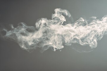 flowing smoke swirls in white tones isolated on soft grey backdrop concept of abstract texture motion design background