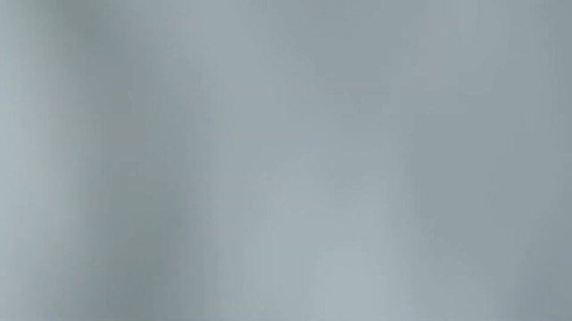 Smooth gray gradient abstract background with subtle flowing motion design