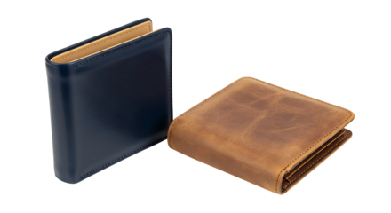 Two open and closed books on a dark surface showing pages and covers