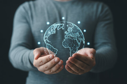 Globalization business concept man holding digital earth hologram worldwide network connection future tech - Powered by Adobe