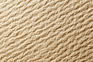 Close-up of a textured, light beige surface