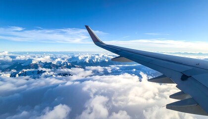 Aerial view of mountains and clouds from an airplane window