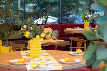 summer vacation season restaurant patio with bright colors interior decoration and furniture cutlery and dish with plants environment