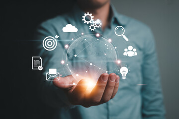 Man holding global network connection with business icons for digital marketing strategy concept