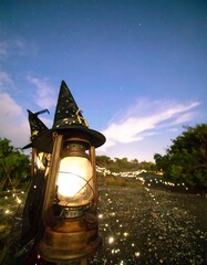 Magical lantern under starry night sky