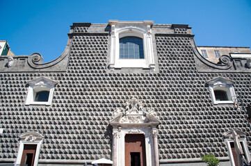 Church of Ges&ugrave; Nuovo or Trinit&agrave;, Naples, Italy.  Facade in piperno stone shaped into ashlars of the former palace built in 1470 for the prince Roberto Sanseverino.