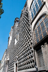 Church of Trinit&agrave; Maggiore or Ges&ugrave; Nuovo in the city's historic center. Naples, Italy.  Piperno stone shaped into ashlars for the facade of the palace built in 1470 for the prince Sanseverino.