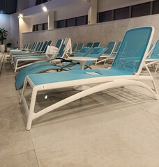 sun loungers near the pool, relaxation area in the spa center