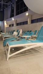 sun loungers near the pool, relaxation area in the spa center