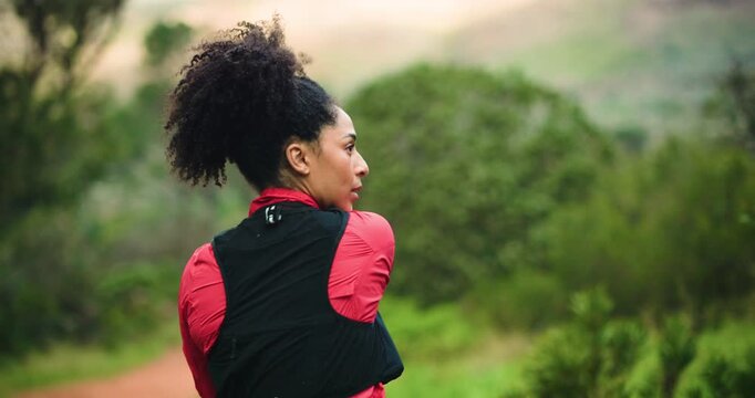 Woman, fitness and stretching arms in nature, exercise or ready for run or hiking in woods. Athlete, warm up and muscle prep before workout, cardio and space in forest to start trekking challenge