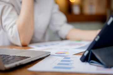 Organized stack of business documents and paperwork on office desk, representing planning, financial analysis, management, efficiency, responsibility, and deadline-focused professionalism.
