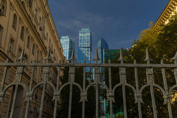 Naklejka premium High-rise buildings and skyscrapers on a sunny summer day.