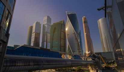 Naklejka premium High-rise buildings and skyscrapers on a sunny summer day.