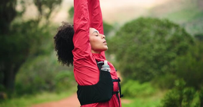 Woman, exercise and stretching arms in nature, fitness or ready for run or hiking in woods. Athlete, warm up and muscle prep before workout, cardio and space in forest to start trekking challenge