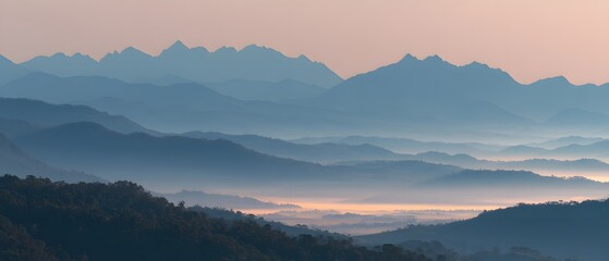Fototapeta premium sunrise valley mountain peaks misty