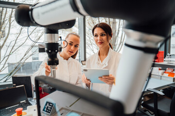 Scientists using robotic AI support in laboratory for medical research