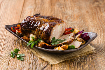 Whole roasted pork neck.