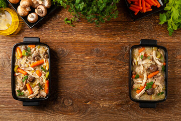 Chicken casserole. Served in black pots.