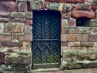 old wooden door in a stone wall