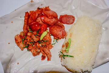 Thai Street Food Sticky Rice with Fried Pork and Sausage, Deep fried Pork with Sticky Rice
