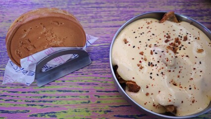 Traditional Korean dessert and savory dish served on a colorful wooden table