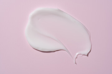 White cosmetic cream texture, skincare lotion swatch on pastel background. Face creme, body moisturizer, hair conditioner smear smudge stroke. Creamy beauty product closeup
