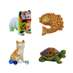 Collection of four decorative animal figurines including a lion dog cat and turtle