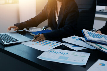 Team of business people working together in the meeting room office,
teamwork background charts and...
