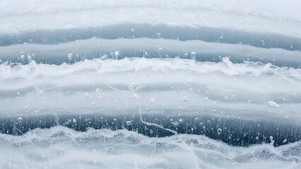 Abstract close-up of frozen water with horizontal lines and bubbles creating a serene and textured natural background