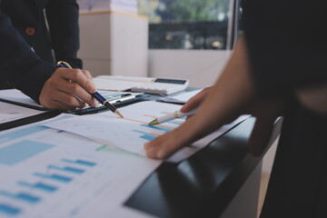 Team of business people working together in the meeting room office,
teamwork background charts and...