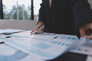 Team of business people working together in the meeting room office,
teamwork background charts and...
