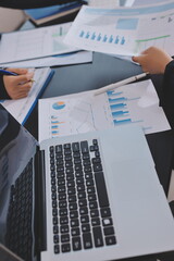 Team of business people working together in the meeting room office,
teamwork background charts and...