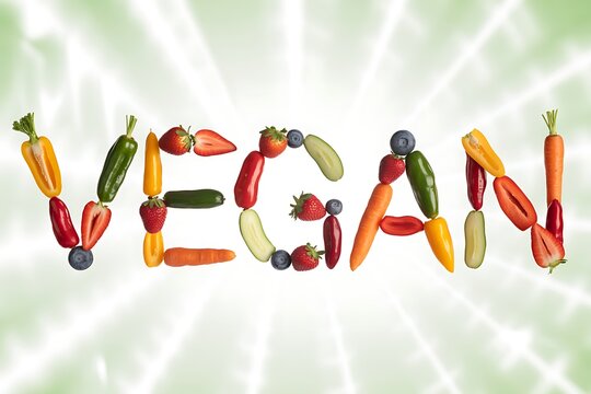 Vibrant fresh fruits and vegetables artfully arranged spelling VEGAN concept for healthy eating and lifestyle - Powered by Adobe