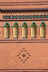 Decorative facade of neo-Gothic Main Post Office located on Old Town Market Square, Torun, Poland