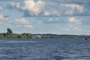 Summer water landscape with a view of the TNA-1500 (RT-64) radio telescope of the Kalyazin Radio Astronomy Observatory in Kalyazin. Tver region, Russia