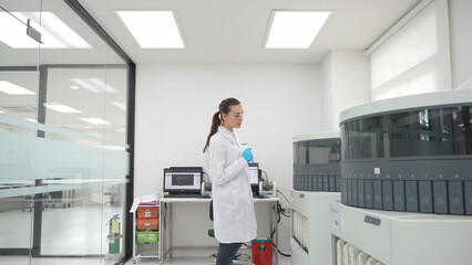 Scientist working in a modern laboratory with advanced equipment for research