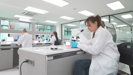 Researchers conduct experiments in a modern laboratory equipped with advanced technology